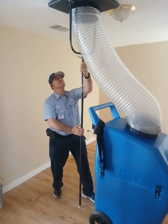 HVAC Installation technician using HEPA equipment in Garfield